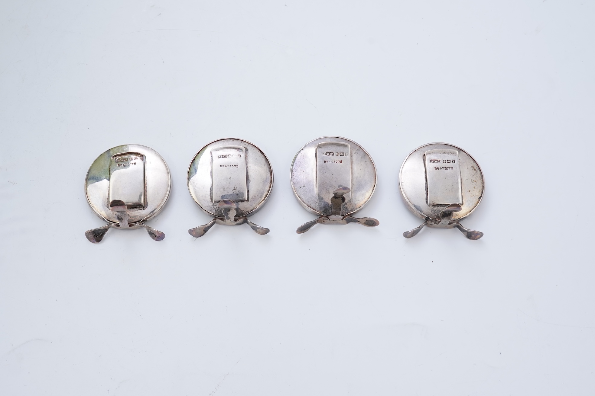 A set of four early 20th century silver mounted fishing related novelty menu holders, by Grey & Co, housed in a red leather case with gilt initials RV